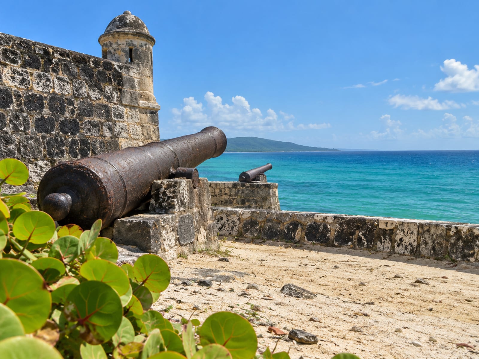 An old stone fort with cannon facing the sea