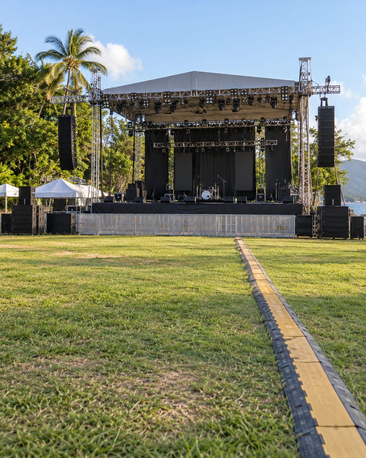 An empty open-air stage and lawn before a concert